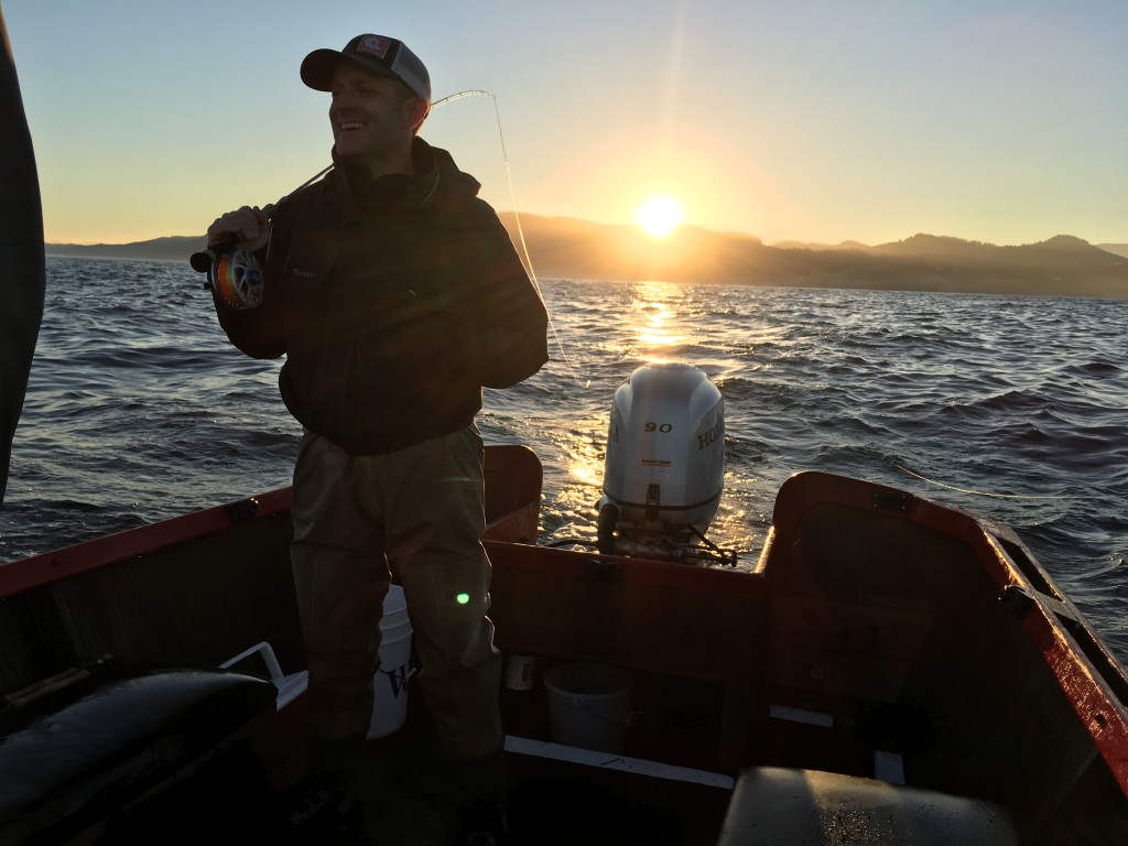 Rob Perkin is ready for a coho to grab with the sun rising in the east.